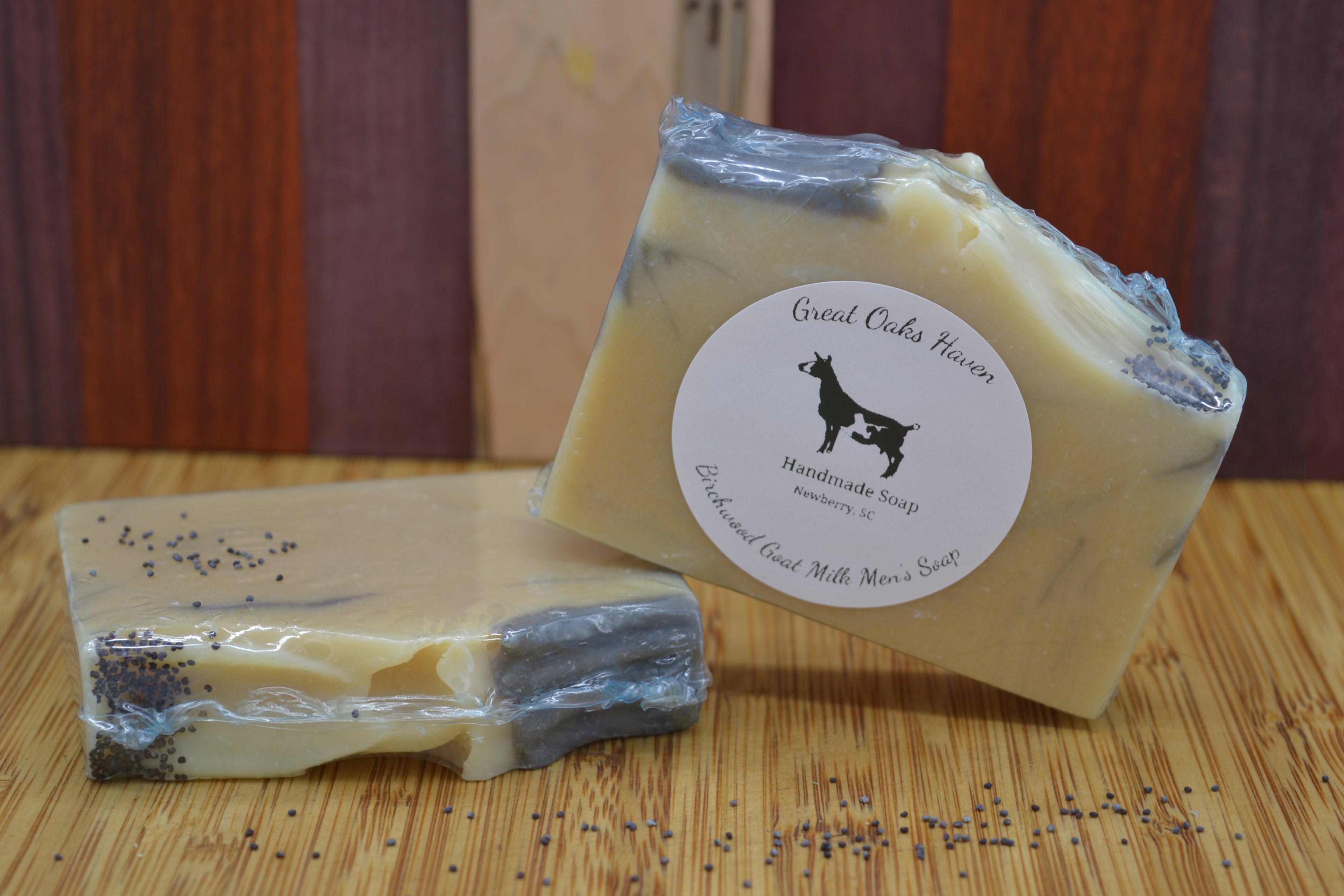 Two bars of soap with a visible label on a wooden surface